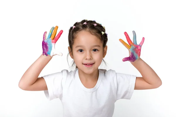 Niña con las manos pintadas en pintura colorida —  Fotos de Stock