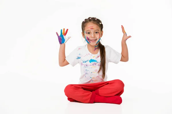 Little child girl with hands painted in colorful paint — Stock Photo, Image
