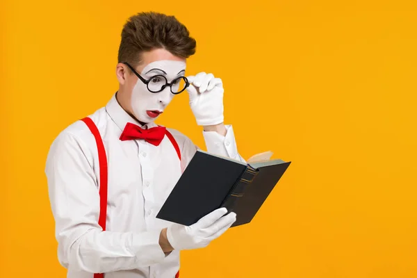 portrait of mime man artist with book