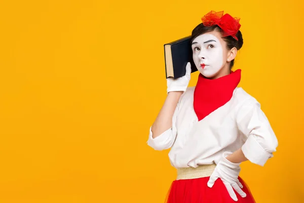 portrait of mime woman artist with book