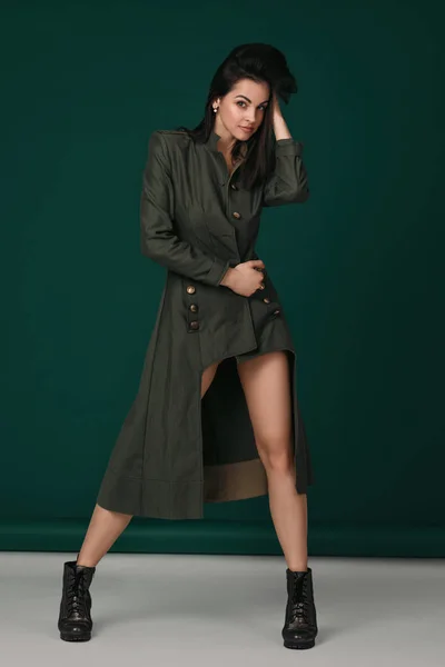 Young woman in black lingerie and coat posing — 스톡 사진