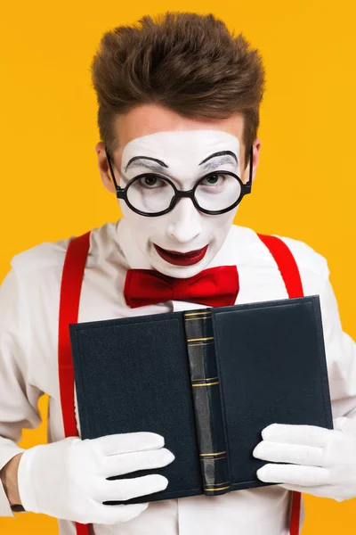 portrait of mime man artist with book