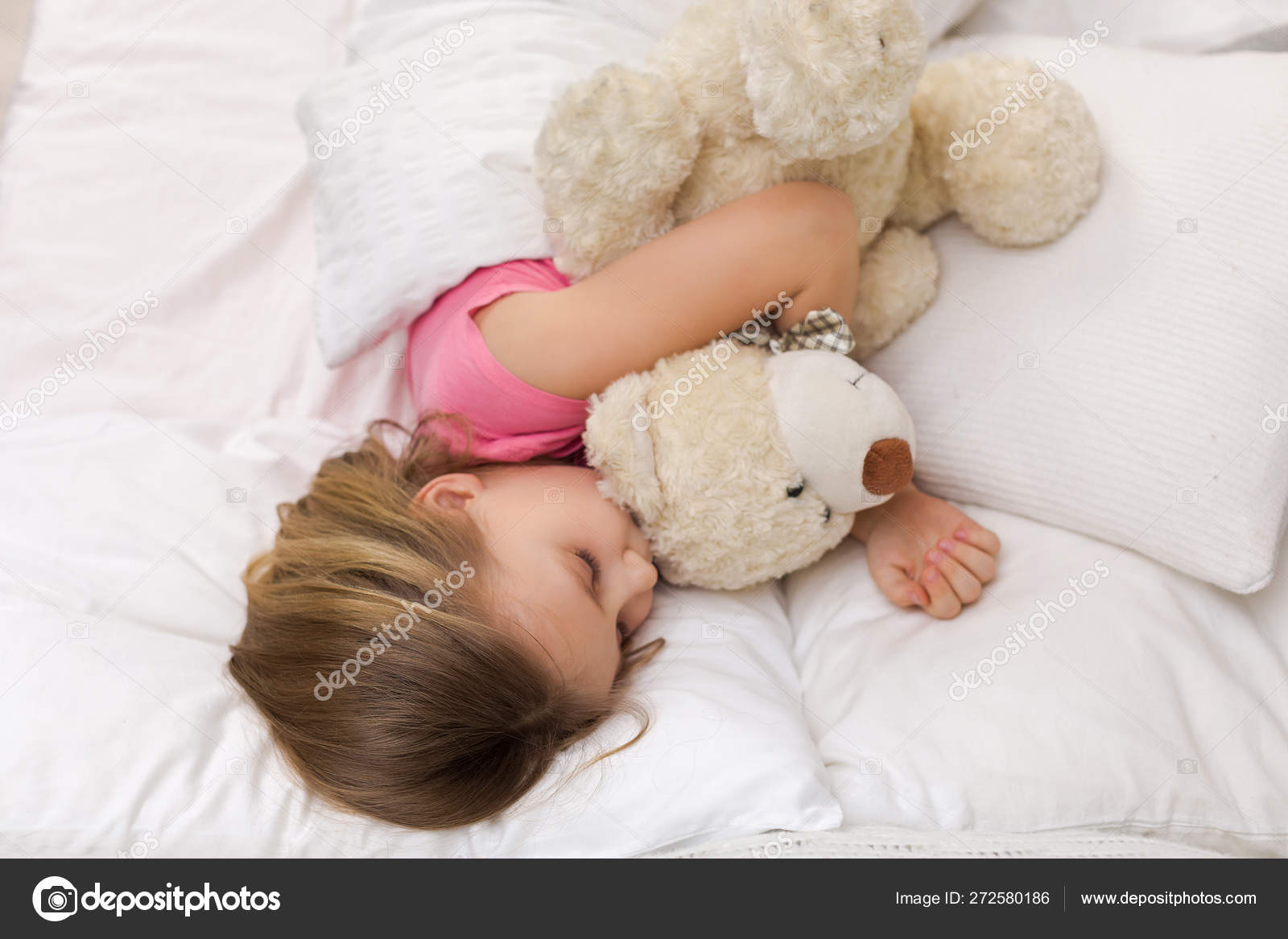 cute baby sleeping with teddy