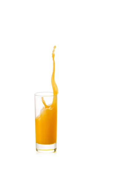 Splash of orange juice in glass — Stock Photo, Image