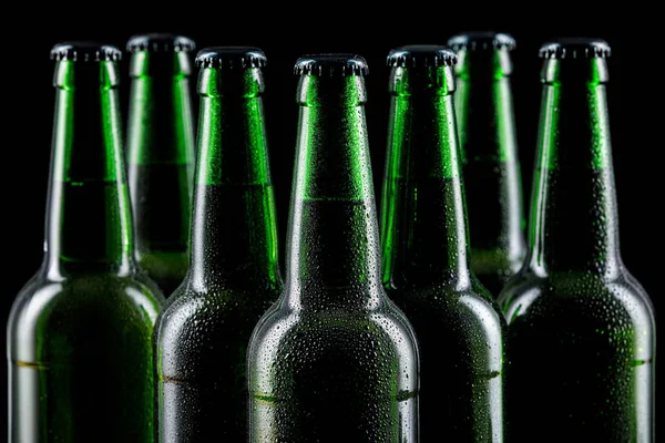 Row of glass bottles of beer — Stock Photo, Image