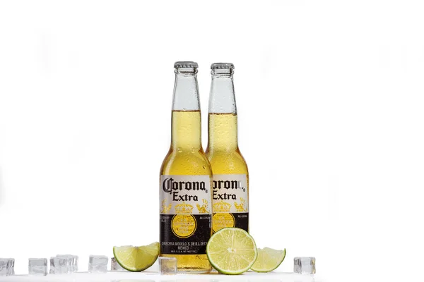 Dnipro, Ukraine - July 21, 2019: Corona bottle with lime fruit ready to drink on white background. — Stock Photo, Image