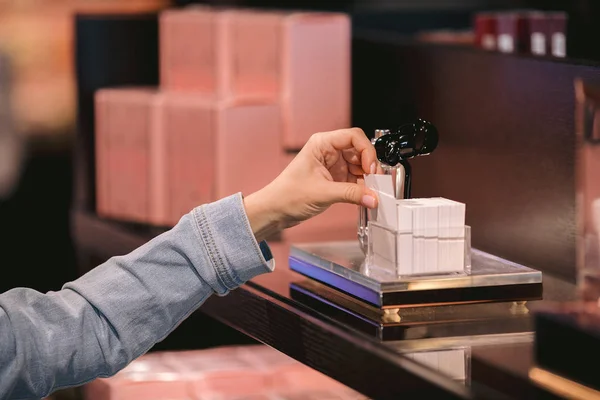 customer looking cosmetics in make-up shop