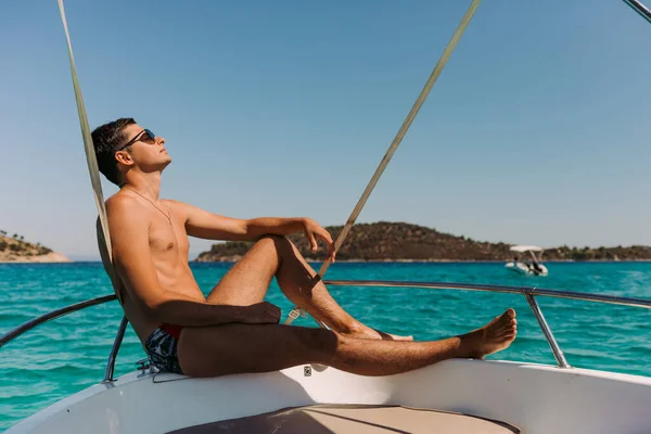 man relaxing on yacht in the sea.