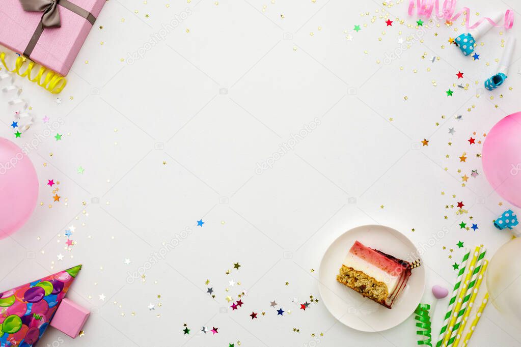 Birthday party background. party hats, balloons, streamers and confetti with copy space