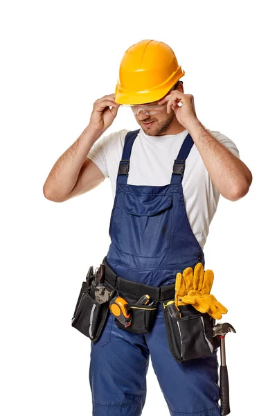 Repairman worker in yellow hard hat and uniform. — Stock Photo, Image