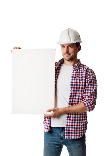 Handyman worker in hard hat holding empty blank board. — Stock Photo, Image