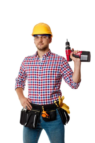 Worker in yellow hard hat holding cordless screwdriver. — Stock Photo, Image