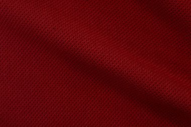 Bir parça buruşuk elbisenin kırmızı arka planı. Üst Manzara. Buruşuk polyester. Kumaşın dokusu, arka plan olarak kullanışlı..