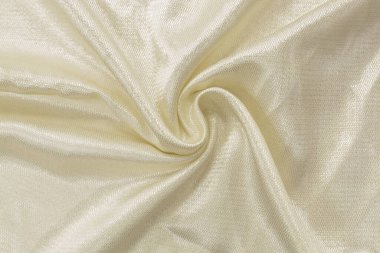 İpek kumaş. Fildişi renginden, arkaplanından, ipekten, satenden oluşan yapay bir kumaş.