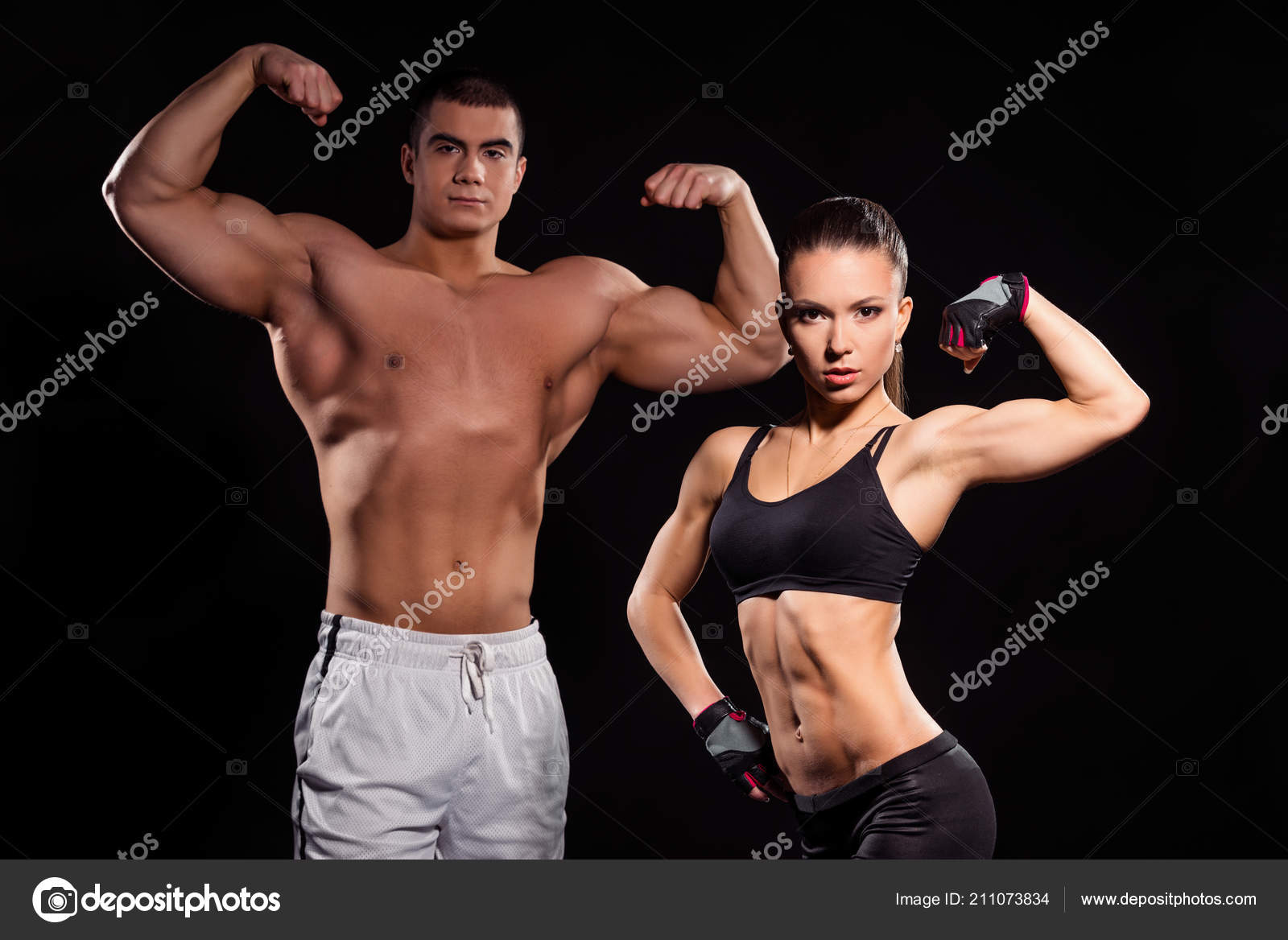 Muscular couple flexing arms. Stock Photo by ©YGphoto 211073834