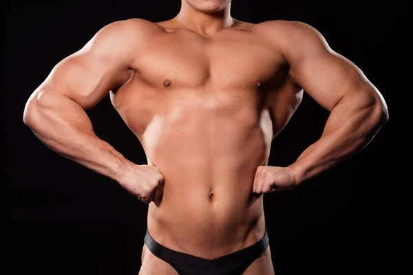 Bodybuilder vorne in Latzhosen-Pose. — Stockfoto