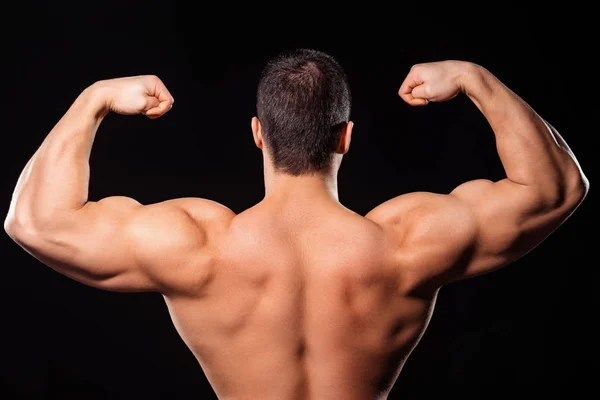 Mens bakre dubbel biceps utgör. — Stockfoto