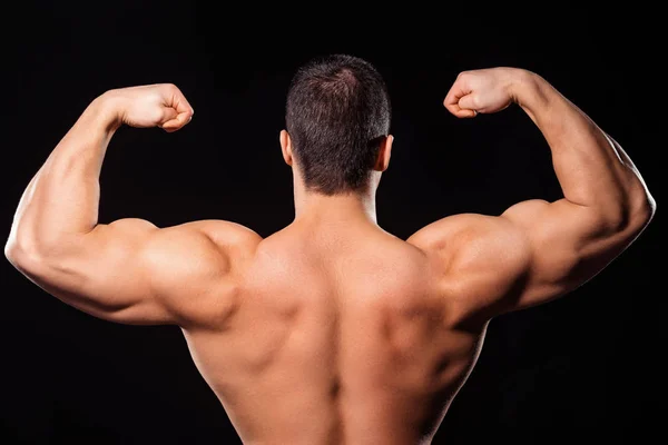 Mens rear double biceps pose. Stock Photo