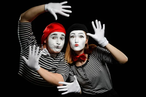 Mimes leaning on imaginary wall — Stock Photo, Image