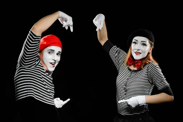 Mimes points at imaginary object