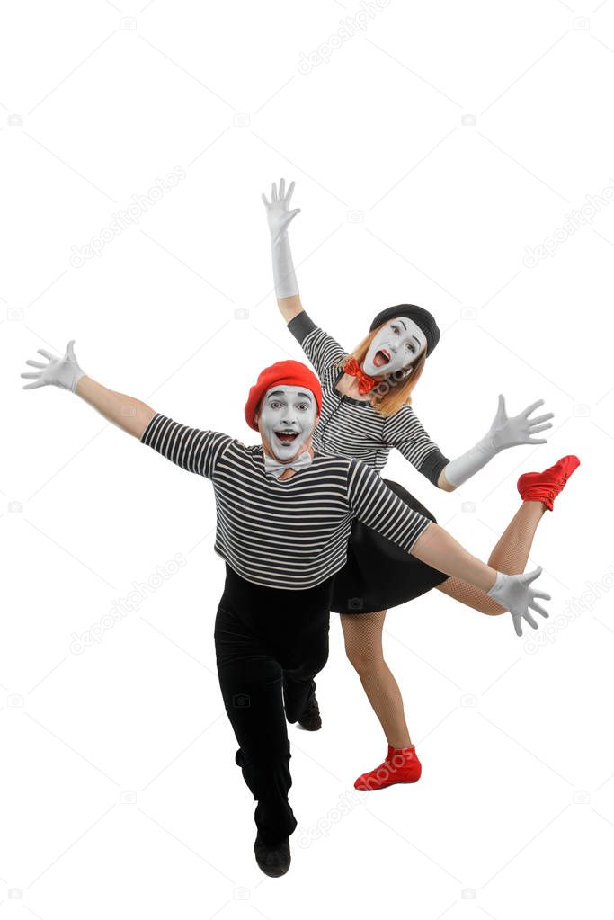 Male and female mimes dancing