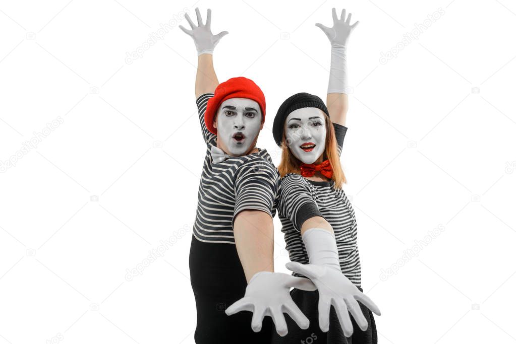 Mimes standing back to back