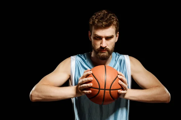 Muscular player squeezing a basketball — Stock Photo, Image