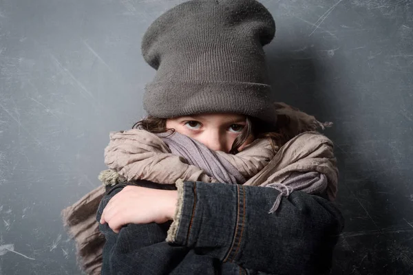 Embarrassed girl wearing shabby clothes — Stock Photo, Image