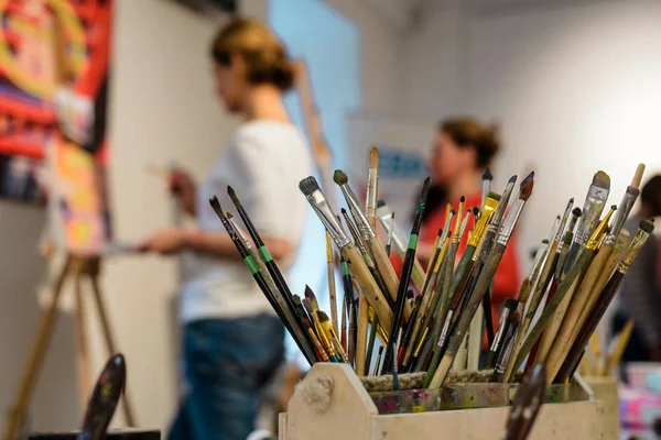 Artistic brushes in wooden holder