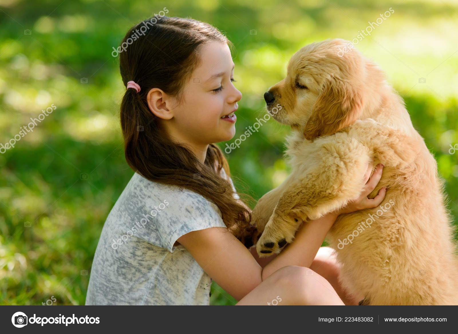 Kid is holding a puppy — Stock Photo © YGphoto #223483082