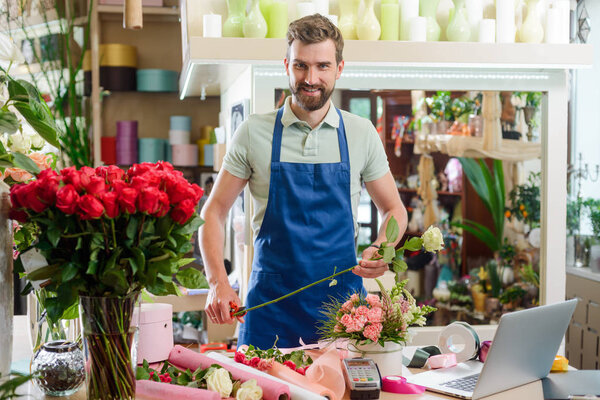 Male florist in flower shop