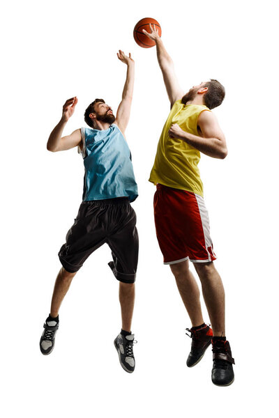 Jumping basketball players on white