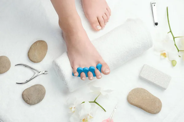 Womans foot with toe separator — Stock Photo, Image
