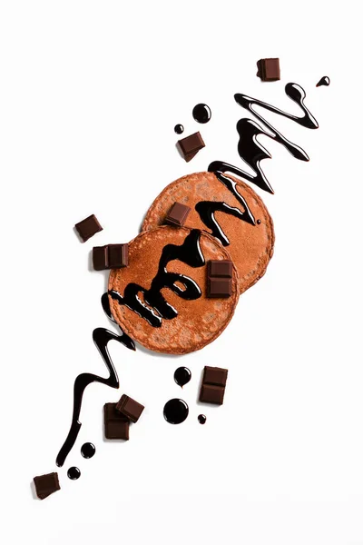 Braune Pfannkuchen und dunkle Schokolade — Stockfoto