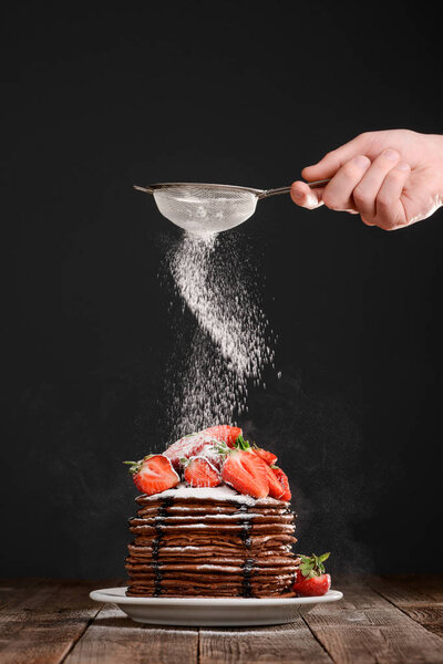 Portion of pancakes with strawberries