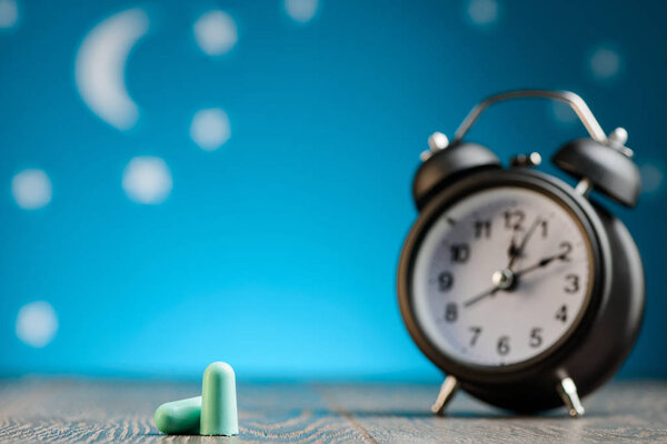 Earplugs and alarm clock