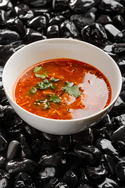 Bowl of red spicy soup — Stock Photo, Image