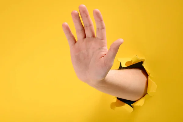 Hand showing stop gesture