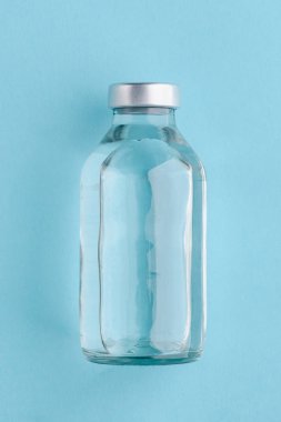Medical bottle on blue background clipart