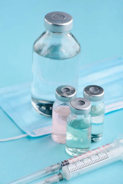 Vials, syringes and face mask