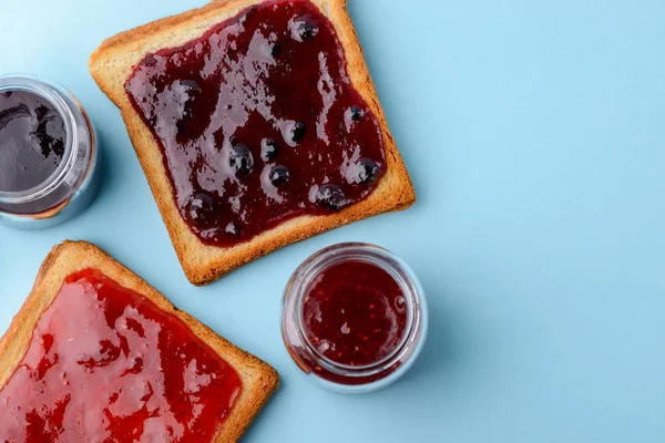 Toast with jam on blue