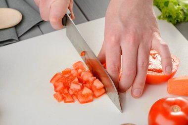 Man chopping a tomato clipart
