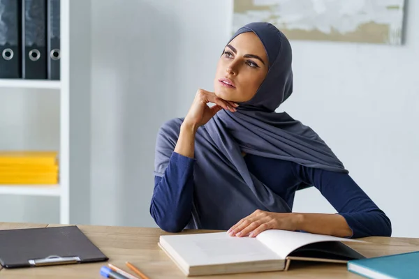 Muslim woman pondering about