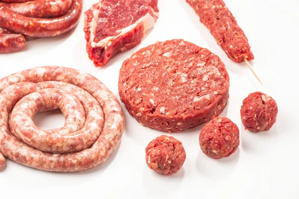 Assortment of semi-finished meat products on white background