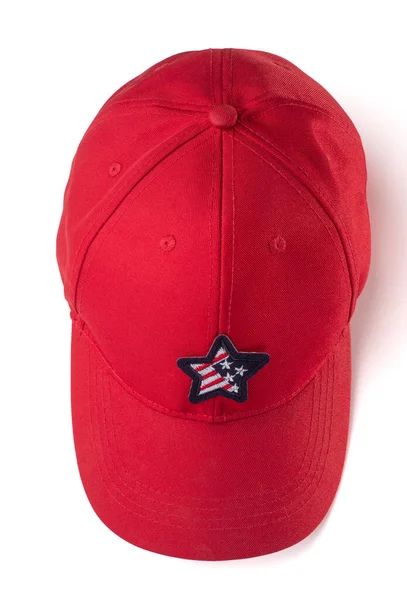 Gorra roja con parche estrella de bandera americana sobre fondo blanco — Foto de Stock