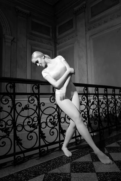 Beautiful Young Ballerina Dancing in Old Building