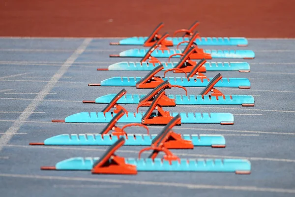 Blue and Orange Starting Blocks in Track and Field