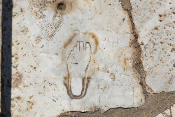 Footprint on Marble for advertisement of the Brothel in Ephesus, Izmir City, Turkey