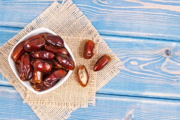Dates containing vitamins and dietary fiber, natural sources of minerals, concept of healthy lifestyle and nutrition