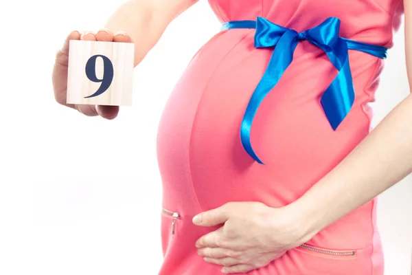 Hand Van Vrouw Met Aantal Van Negende Maand Van Zwangerschap — Stockfoto